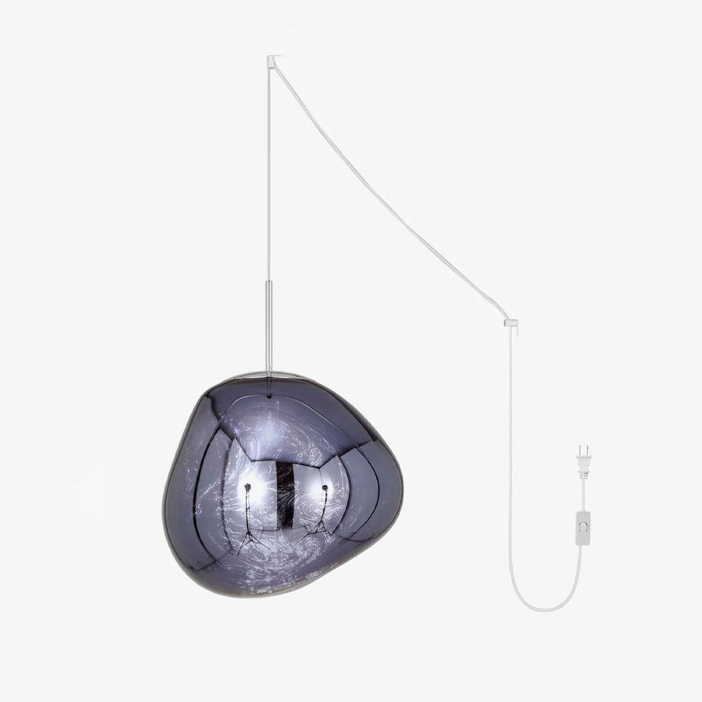 Lava pendant light glowing warmly over a dining table