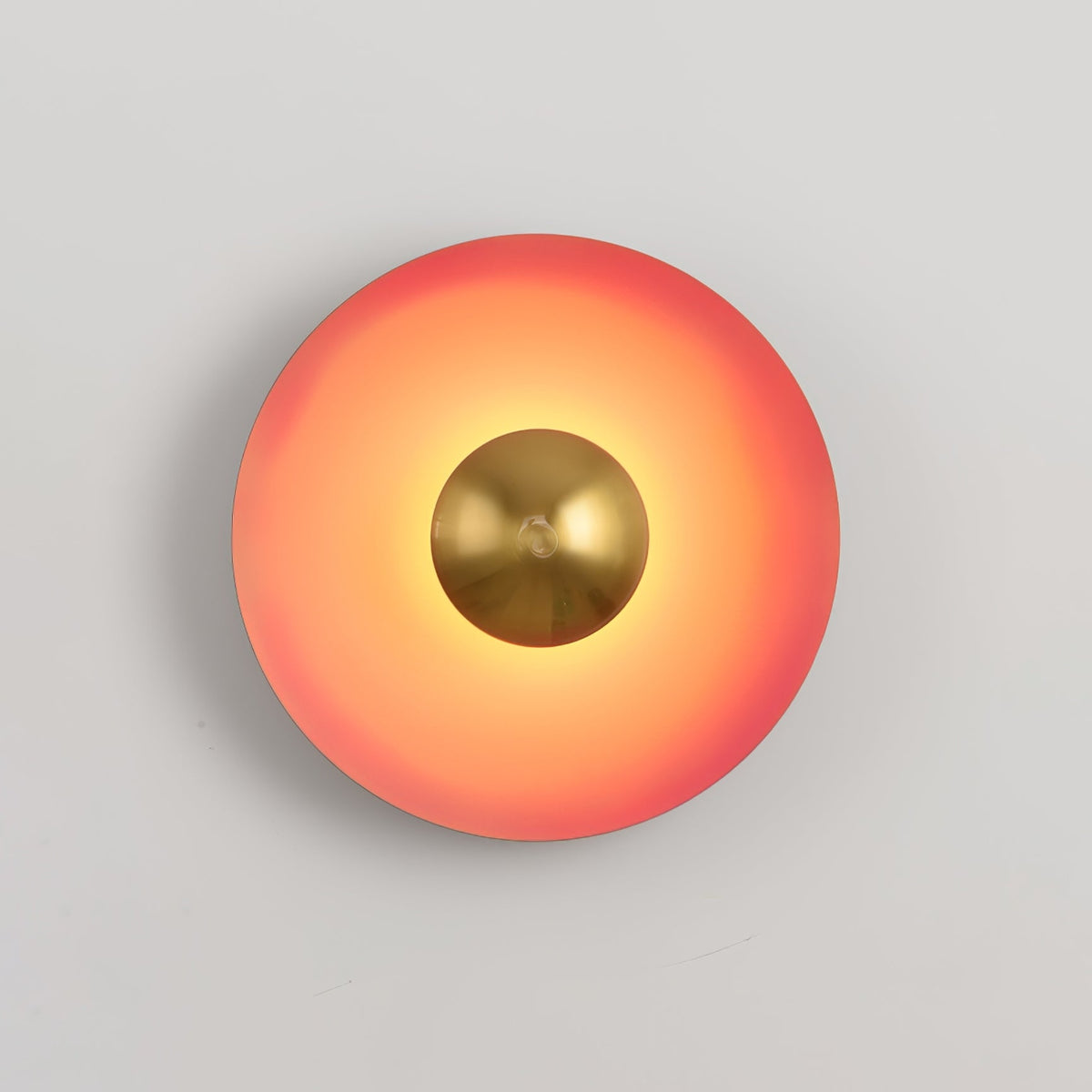 A tighter crop shows the antique copper centre of this coral-orange Clérachic wall light glowing bright.