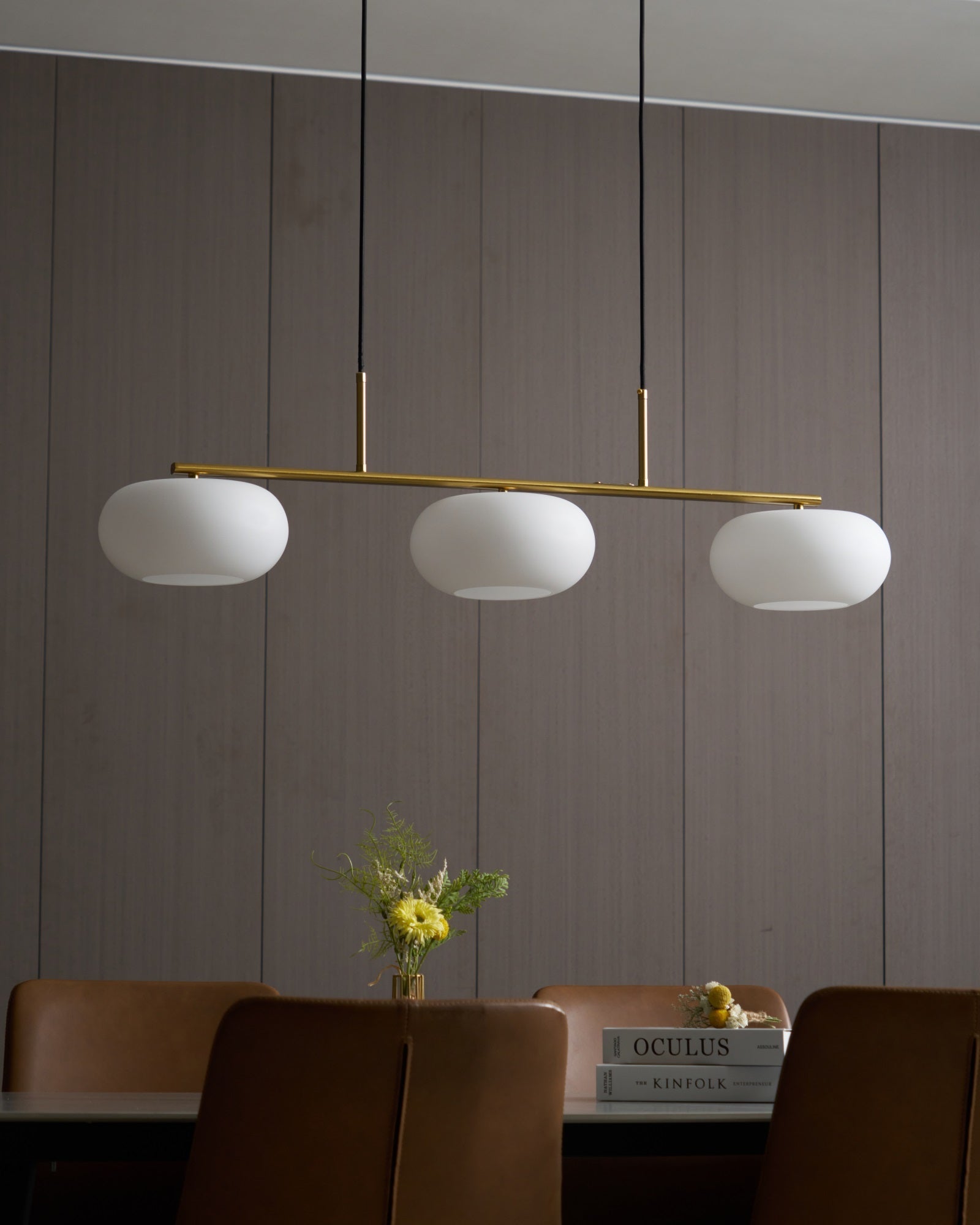 Linear three-globe pendant light viewed from below