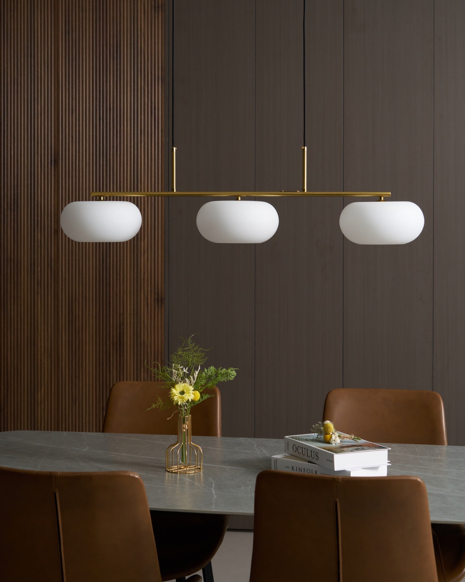 Globe pendant light fitting shown against a pale background