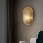 Lit in a bedroom corner beside a floor-length curtain and a dark green chair.
