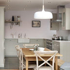 Acorn pendant light hanging in a Shaker-style kitchen