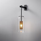 Copper-finish wall lamp with clear glass shade shown in detail