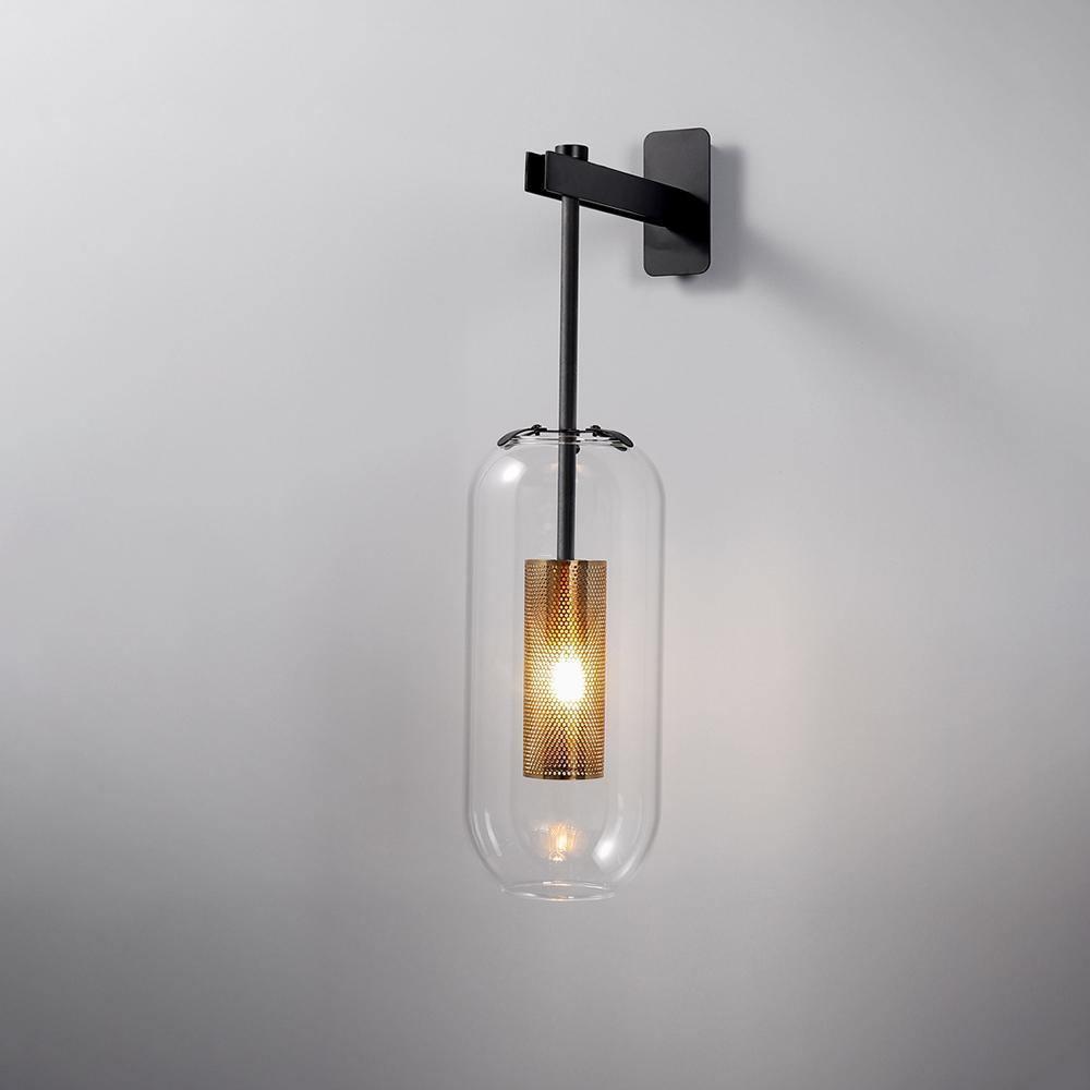 Copper-finish wall lamp with clear glass shade shown in detail