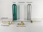 Modern glass wall sconce mounted with cylinder shade glowing