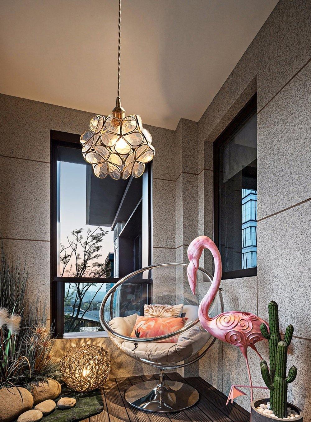 Blue glass petal pendant light with brass suspension fitting