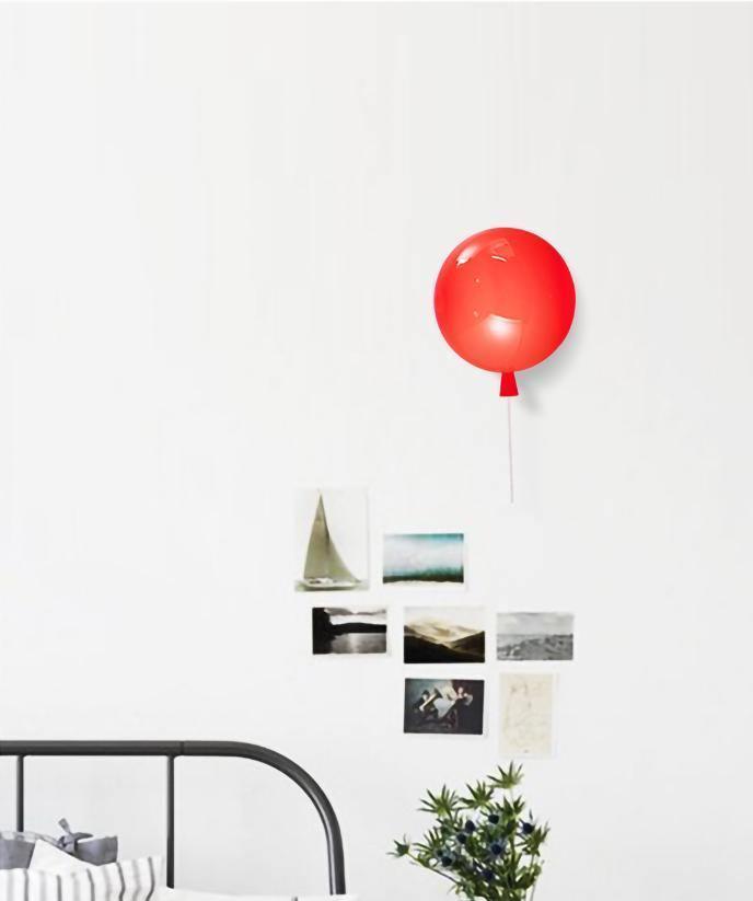 Balloon-shaped wall light mounted on a feature wall