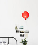 Balloon wall light with rounded shade and dangling cord