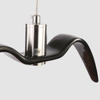 Close view of the nickel neck joint marked 3W on this black Clérachic pendant.