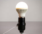 Sculptural balloon wall sconce with pull cord switch