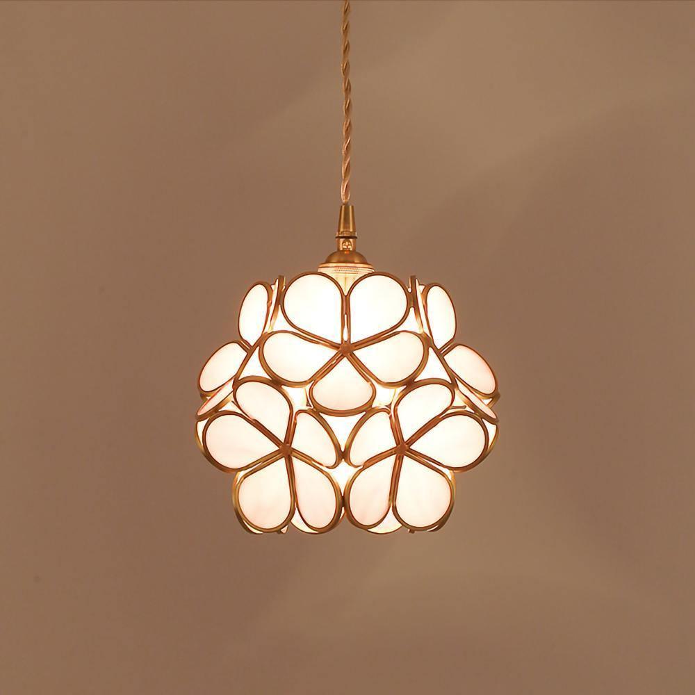 Glass petal pendant light with warm brass fitting close up