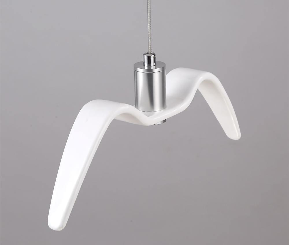 A single white bird-shaped pendant from this Clérachic light is seen in profile against a plain grey backdrop.