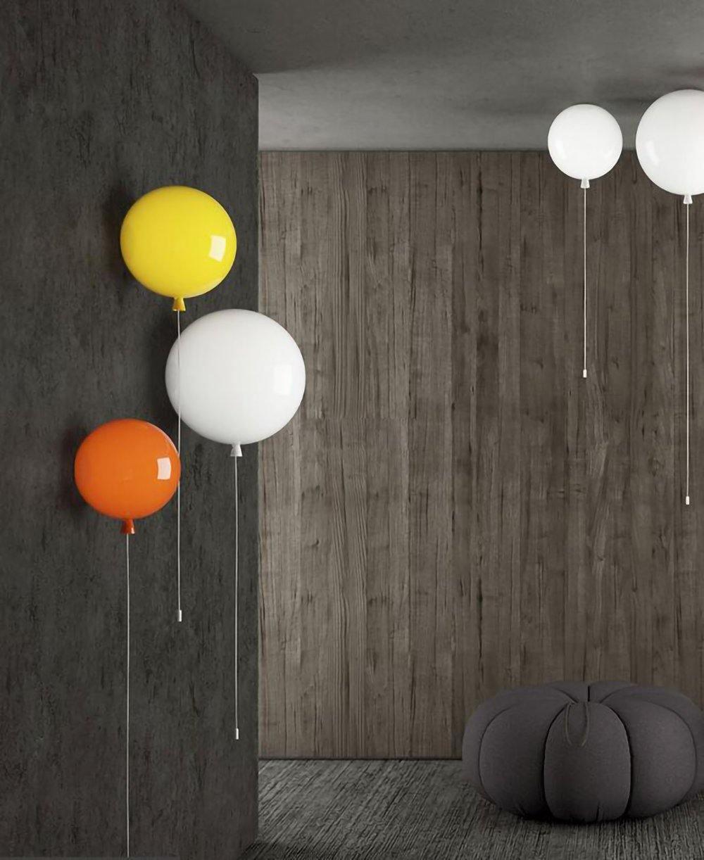 Colourful balloon wall sconce with pull cord on a wall