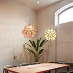 Coloured glass petal pendant lights clustered at varied drops