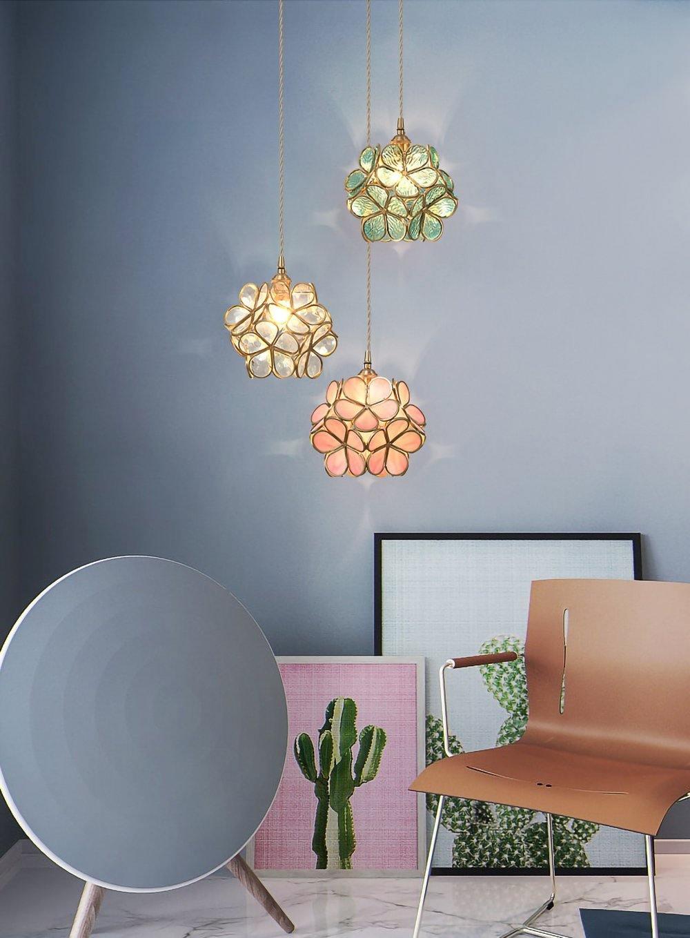 Glass petal pendant light glowing near an entrance