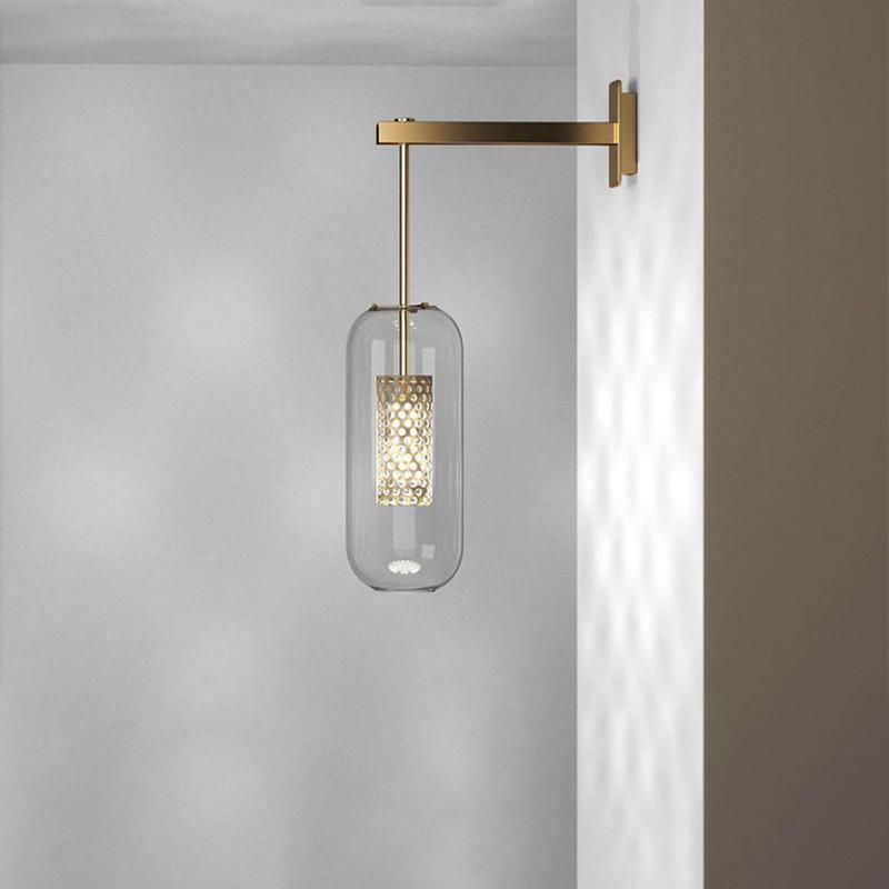 Glass wall lamp with slim arm mounted beside framed wall art