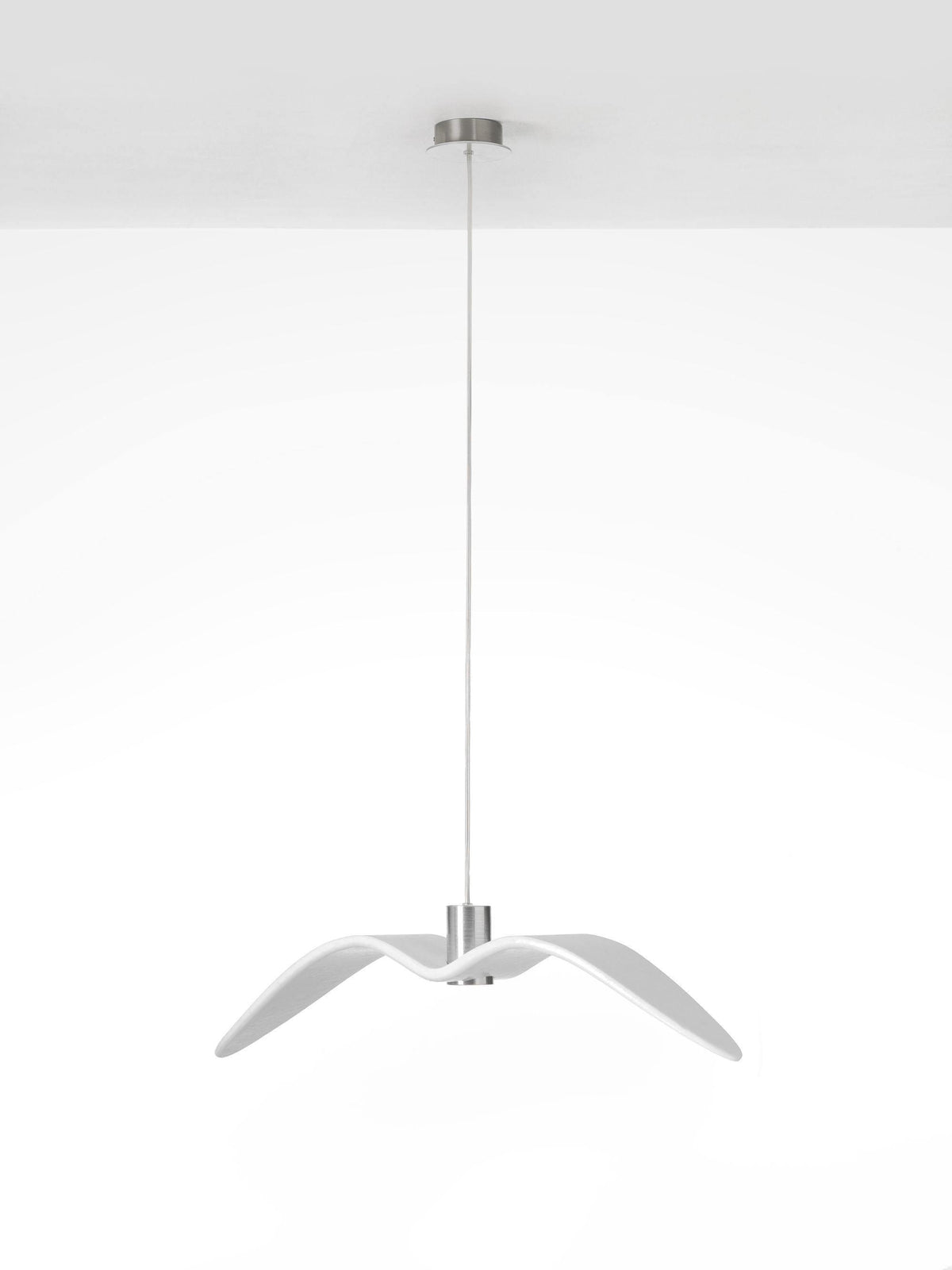 A white bird-shaped pendant from this Clérachic fixture hangs with its wings swept narrow, on a plain white backdrop.