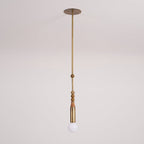 The Clérachic pendant light pictured alone on a light backdrop, showing its slim brass rod and glowing bulb.