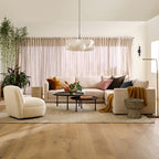Elysia pendant light glowing above a living room seating area