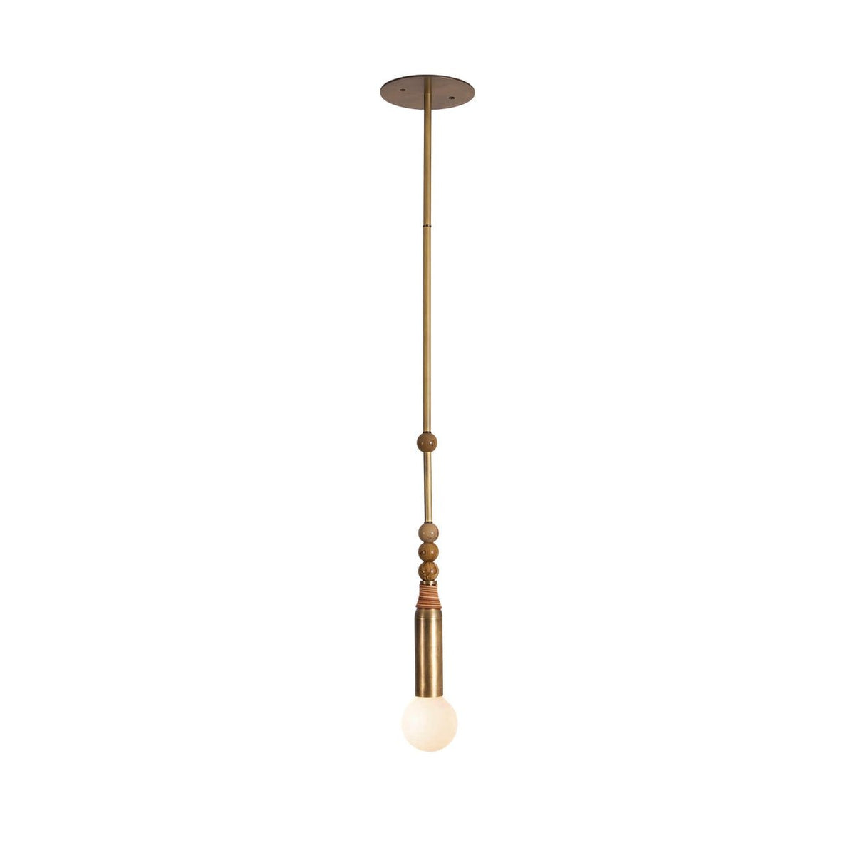 The Clérachic marble-bead pendant hangs from a round brass ceiling canopy against a soft neutral backdrop.