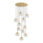 A large dense cascade of amber glass shades drops from a gold ceiling plate, this Clérachic fixture shown on a white background.