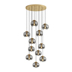 Smoky grey glass shades cascade unevenly from a gold ceiling plate, this Clérachic fixture shown in a tall cluster on white.