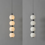 Four-ball Orbique pendant shown lit on the left and switched off on the right for comparison
