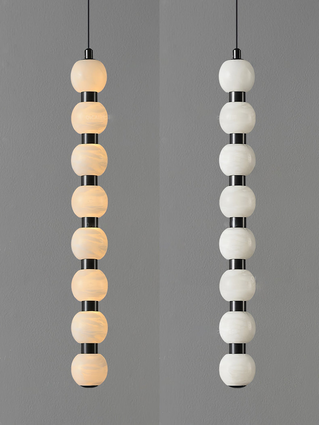 Eight-ball Orbique pendant lit on the left and unlit on the right, showing the alabaster veining