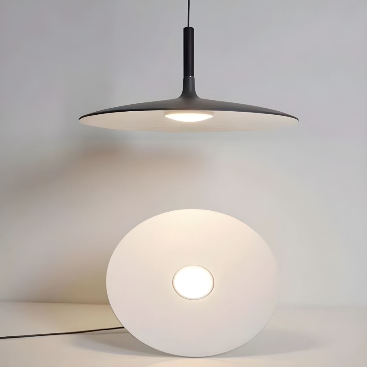 Aluminum pendant light shown from below with even glow
