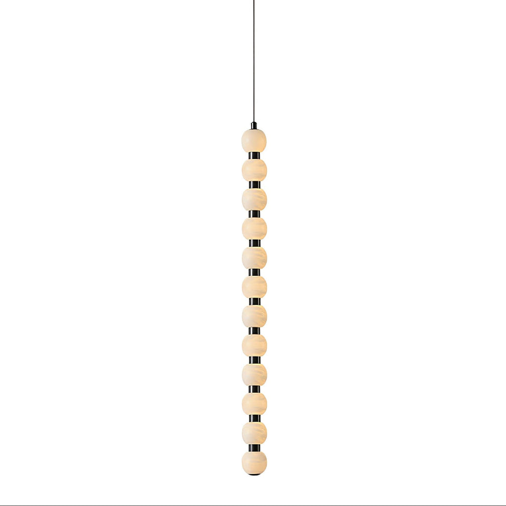 The twelve-ball Orbique pendant at full length, a tall vertical run of glowing alabaster spheres