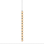 The twelve-ball Orbique pendant at full length, a tall vertical run of glowing alabaster spheres