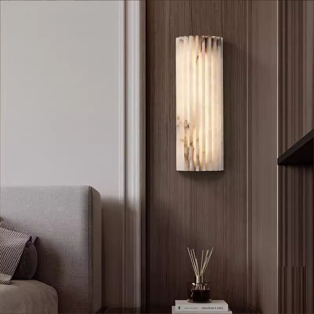 Alabaster wall light mounted in a minimalist hallway