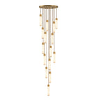 On a white background, a tall cascade of many brass-capped alabaster tubes hangs from this Clérachic pendant.