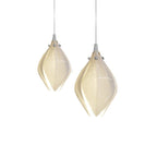 Floral ceramic pendant light glowing softly against a dark ceiling