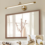 Mounted over a mirror above a wooden coat rack, this gold Clérachic wall sconce is shown with insets of its mounting hardware.