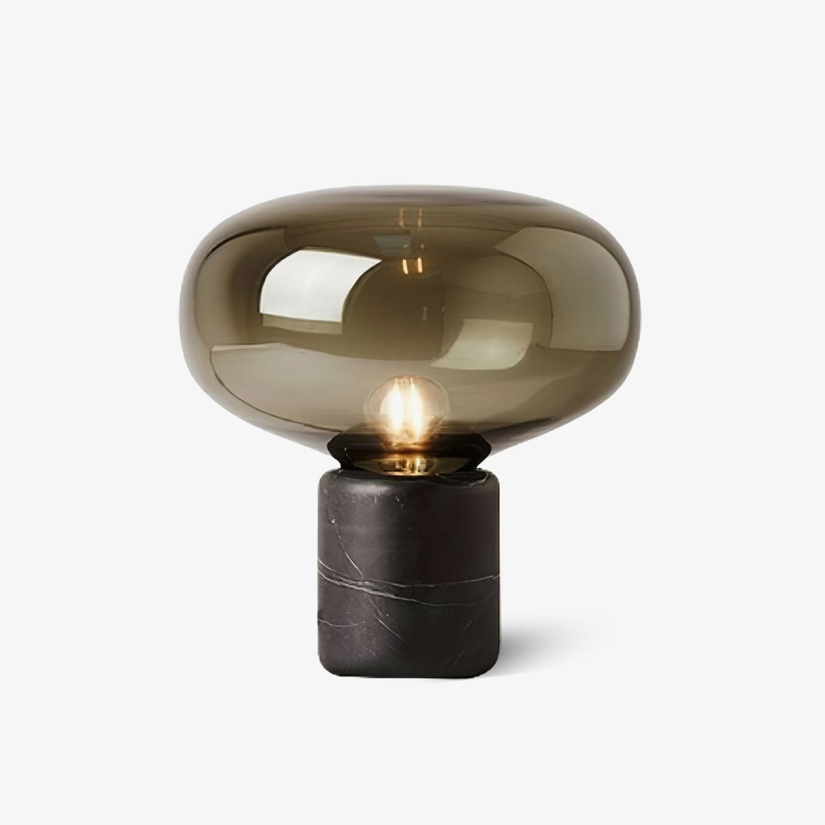 This Clérachic bedside table lamp sits on a plain white ground, showing its smoke-grey glass dome and marble cylinder base in full.