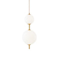 Vertical globe pendant light glowing above a dining table