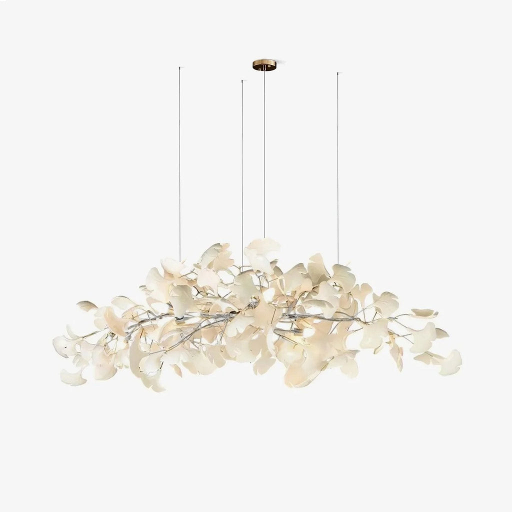 Porcelain leaf chandelier suspended above a styled table