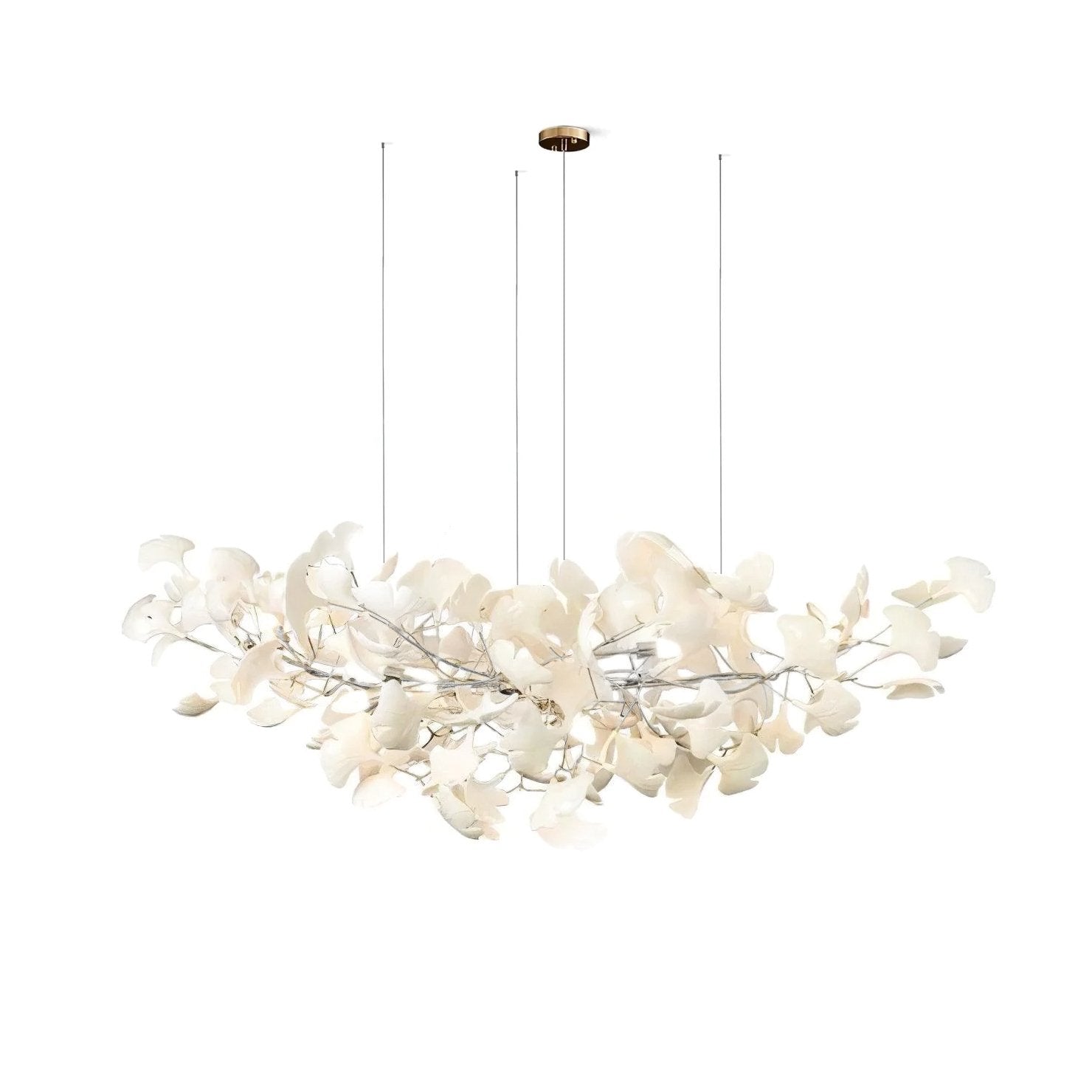 Gingko leaf chandelier glowing warmly in a styled living room