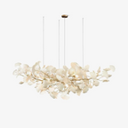 Porcelain gingko chandelier installed above a dining table