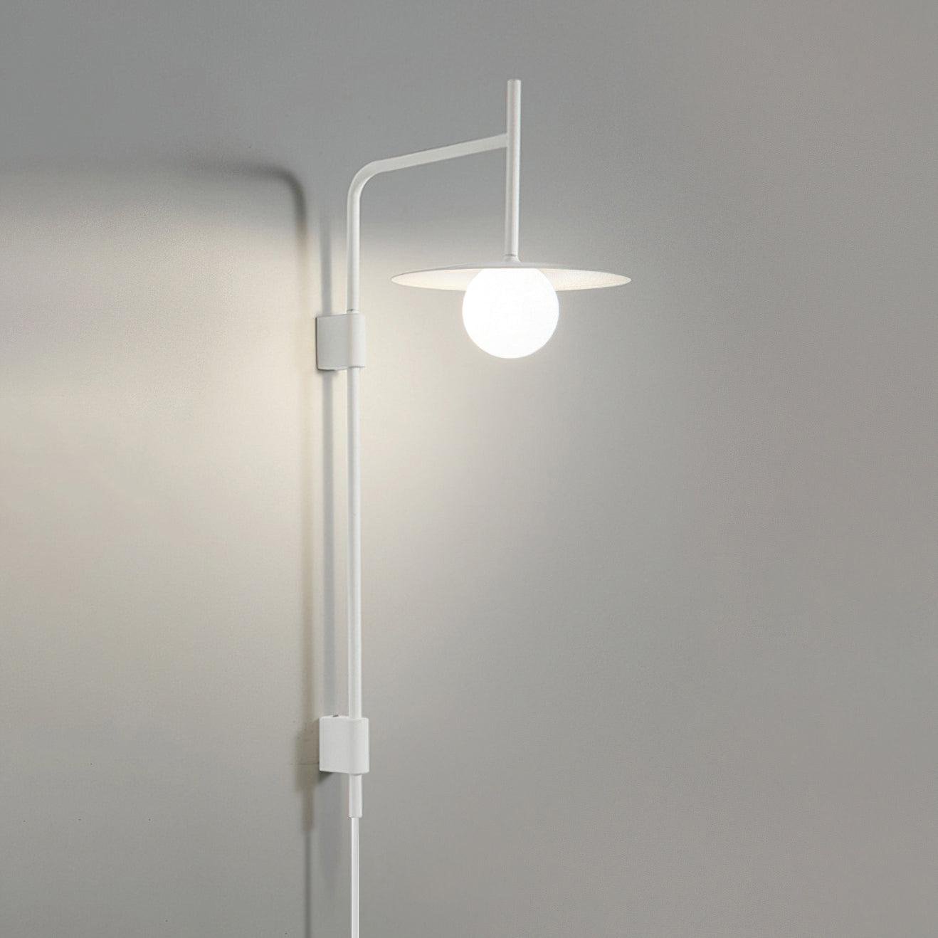 Swing arm wall lamp with frosted glass shade and iron frame