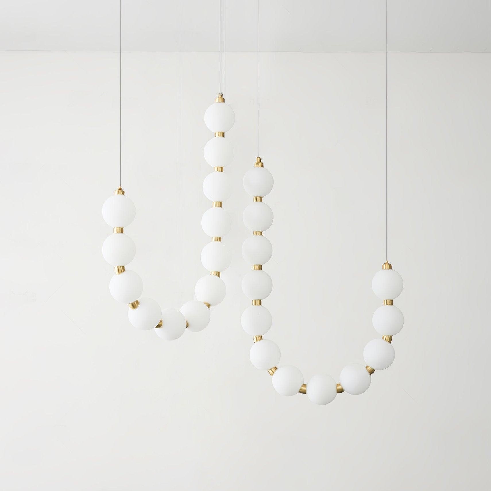Acrylic pearl chandelier with clustered white orbs and warm light