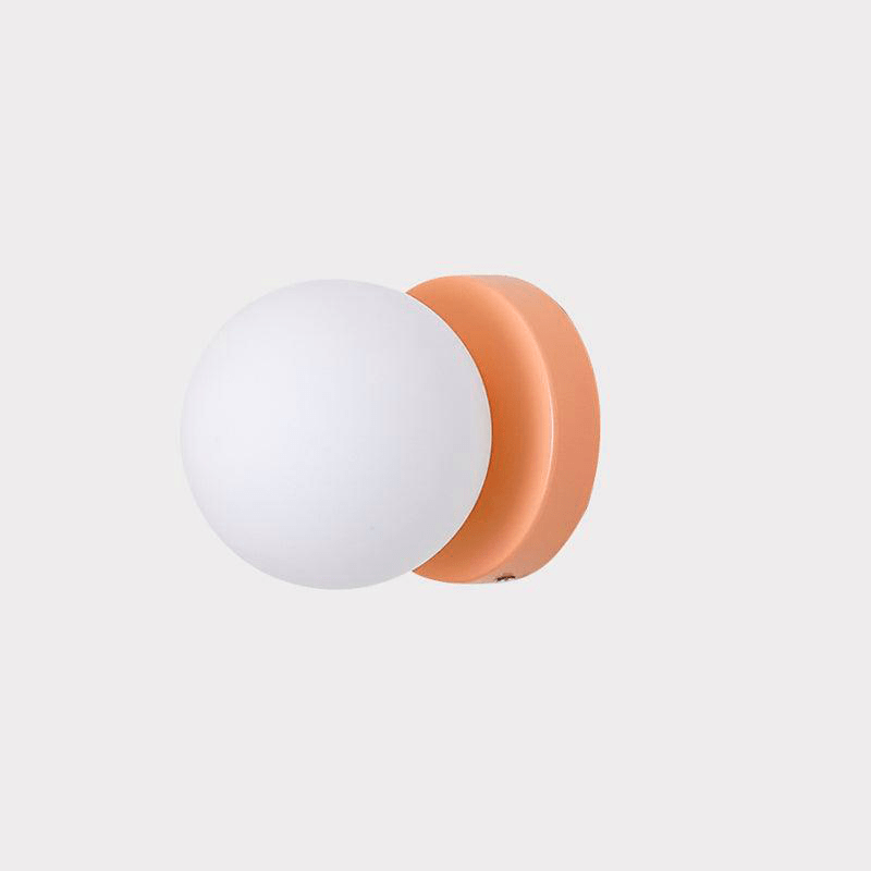 Nuvol wall lamp shown in five body colors with white glass globes