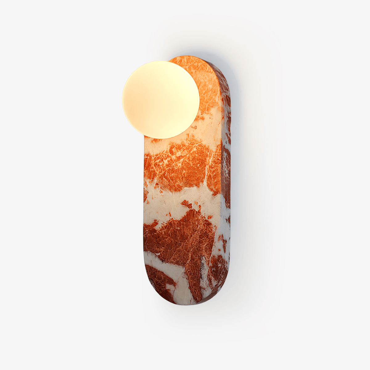 Clérachic wall light with a deep red marble body and a round glass shade, photographed straight on a white background.