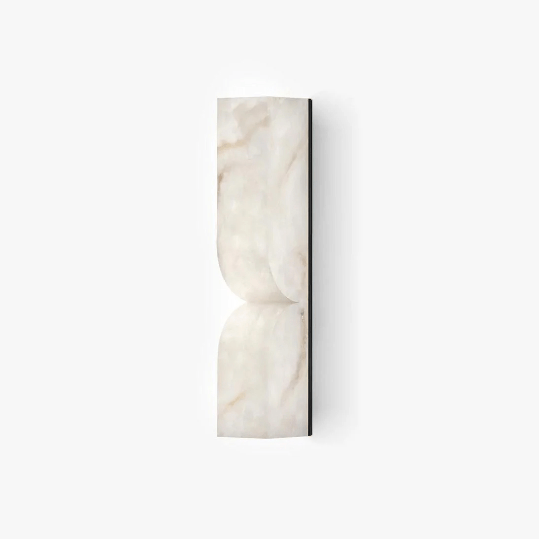 Sculptural alabaster sconce with curved stone form and soft glow