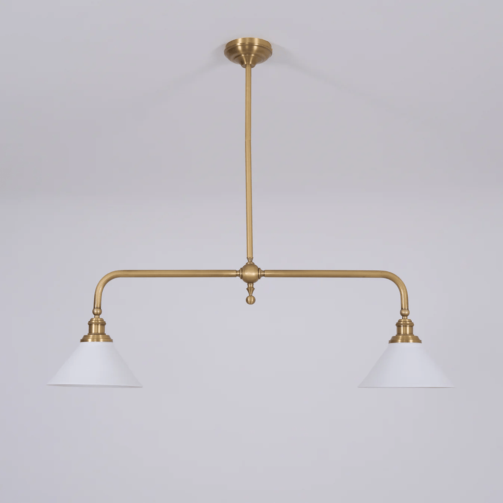 Set on grey, this Clérachic pendant's brass arms and white conical shades sit unlit, seen from a slight angle.