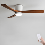 Ceiling fan with natural wood blades shown in a styled room