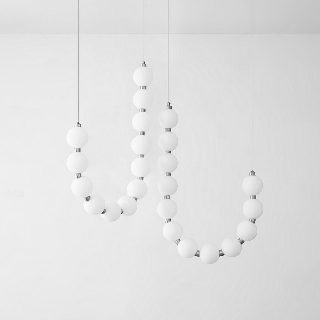 Acrylic pearl chandelier in a waterfall drop over a stairwell