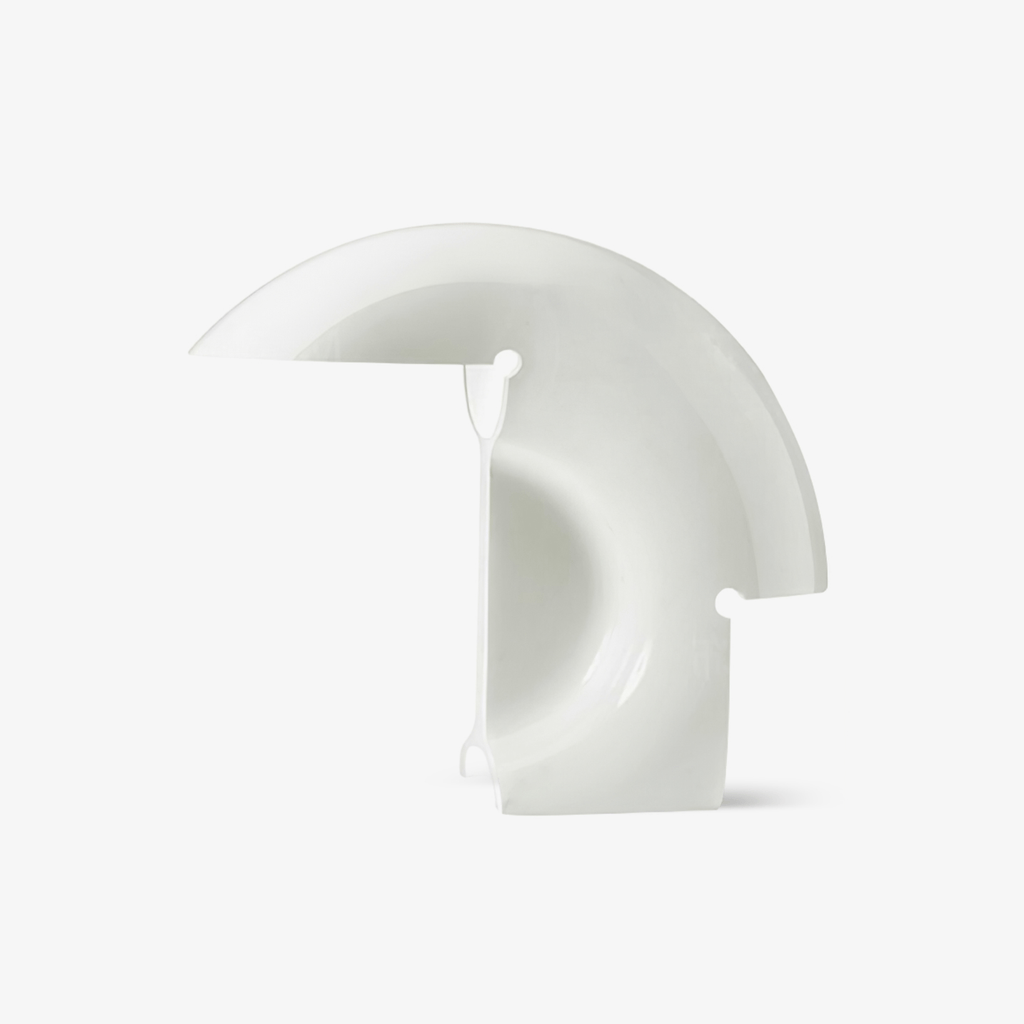 Clérachic curved white resin table lamp photographed unlit on a plain light-grey studio background, showing its crescent shape.