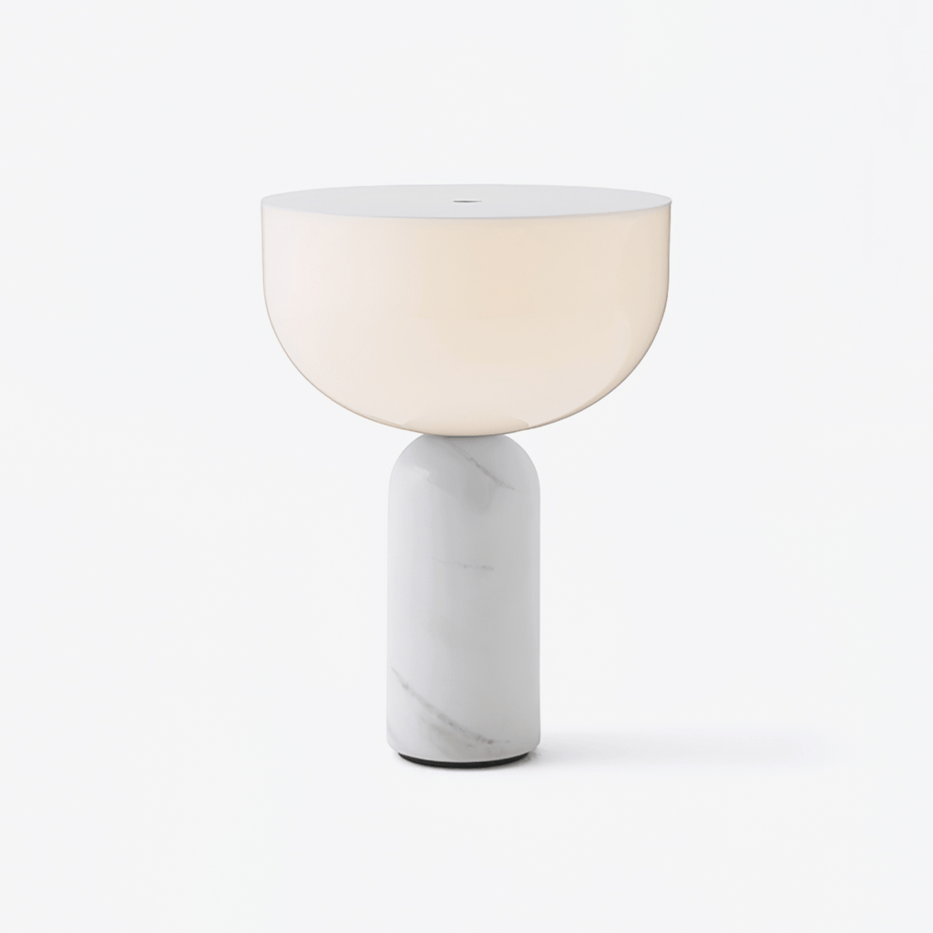 Clérachic hallway table lamp with a frosted white glass dome lit warm above a veined white marble cylinder base, shown on a plain light backdrop.
